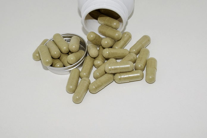kratom tablets out of the plastic bottle